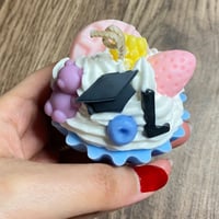 شمعة الكب كيك بثيم التخرج