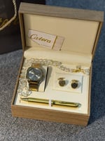 طقم رجالي ذهبي مع فضي Catera