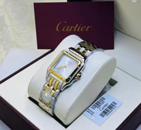 ساعة كارتير ذهبي وفضي بإطار أبيض شامل الملحقات