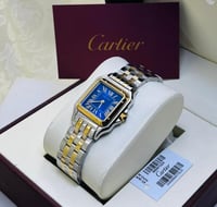 ساعة كارتير ذهبي وفضي بإطار كحلي شامل الملحقات