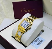 ساعة كارتير ذهبي بإطار أبيض شامل الملحقات