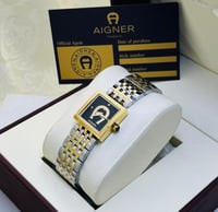 ساعة انقر فضي و ذهبي بإطار أسود ماستر كوبي