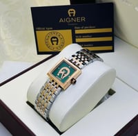 ساعة انقر فضي وذهبي بإطار أخضر ماستر كوبي