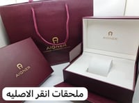 ساعة انقر فضي و ذهبي بإطار أسود ماستر كوبي