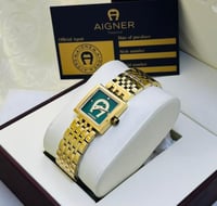 ساعة انقر ذهبي بإطار أخضر ماستر كوبي