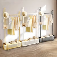 علاقة ملابس فخمة بسلة سفلية ذهبي واسود