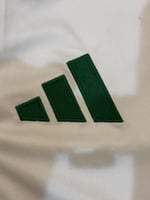 تيشيرت الأهلي البديل 2025/26 مُوقع من نجوم الفريق