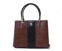 بني مخطط بأسود