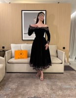 فستان اسود بكلفه