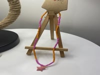 سلسال خرز وردي وبرتقالي وتعليقه نجمه