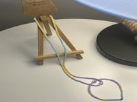 طقم ملون بتعليقه سمايل وحرف R