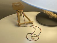 طقم سلسال واسواره خرز ملون تعليقه دولفين وردي ونجم...