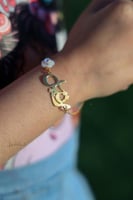 سواره مطليه ذهب مع ورده صدف طبيعي _متجر تفاصيل