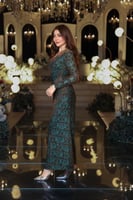 فستان تركواز بلمعة نحاسية ودرابية جانبية