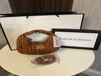 حقيبة ميو ميو بناتي