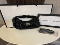 حقيبة ميو ميو بناتي