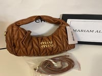 حقيبة ميو ميو بناتي