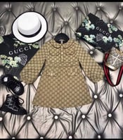 فستان قوتشي بأكمام طويله