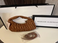 حقيبة ميو ميو بناتي