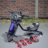 سكوتر درفت صغير مميز بطبعات سوداء 36 فولت بثلاث عج...