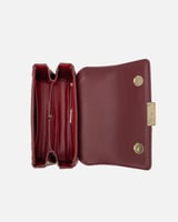 شنطة نسائية أنيقة باللون العودي