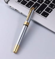 قلم جاف لون فضي على ذهبي