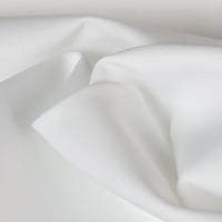 قماش نيوم ناعم طايح ابيض او كريمي