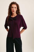 بلوزة محبوكة بفيونكة تول