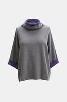 بلوزة واسعة بياقة عالية