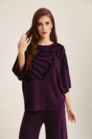 بلوزة فضفاضة بنقوش بارزة