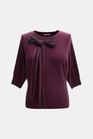 بلوزة محبوكة بفيونكة تول