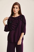 بلوزة فضفاضة بنقوش بارزة