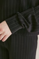 بلوزة مقلمة بقصة فضفاضة