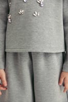 بلوزة مزينة بالكريستال