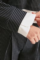 بلوزة مقلمة بقصة فضفاضة