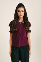 بلوزة محبوكة بياقة من الجلد