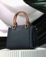 ‎ شنطة نسائية باللون الأسود والبني