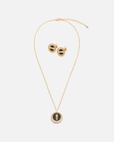 ‎ طقم نسائي أنيق بلون ذهبي