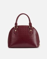 ‎ شنطة نسائية باللون العودي