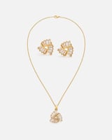 ‎ طقم نسائي ناعم باللون الذهبي