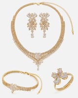 ‎ طقم نسائي فاخر باللون الذهبي