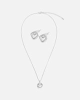 ‎ طقم نسائي بتصميم جذاب بلون فضي