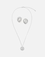 ‎ طقم نسائي بتصميم جذاب بلون فضي