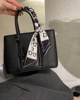 ‎ شنطة نسائية من الجلد بلون أسود | MLH021F020201