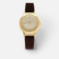 ‎ ساعة نسائية باللون الذهبي وسوار مخملي بني | ZAV0...