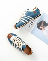 ‎ حذاء نسائي عصري باللون الأزرق