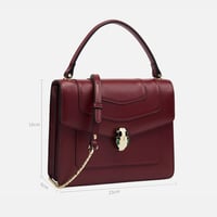 ‎ شنطة زايروس النسائية من الجلد باللون العودي بتصم...