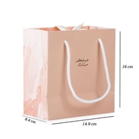 أكياس فاخرة للعيد لون وردي بأطراف رخامية وختم "عيد...