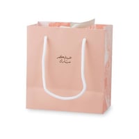 أكياس فاخرة للعيد لون وردي بأطراف رخامية وختم "عيد...