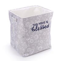 سلة غسيل مزخرفة بتصميم أنيق وعبارة "This Home Is B...